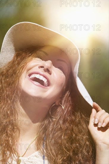 Portrait of woman wearing hat.