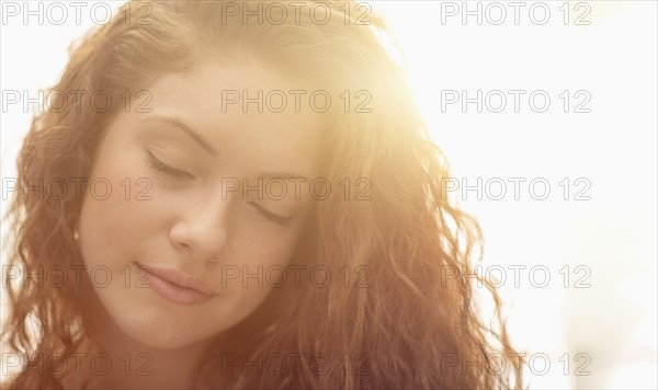 Portrait of woman in sunlight.