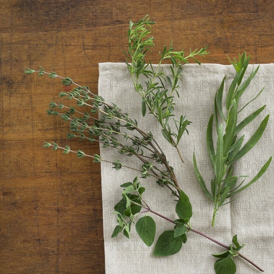 Variation of herbs on table.