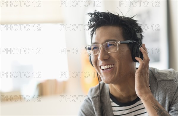 Cheerful man listening to music.