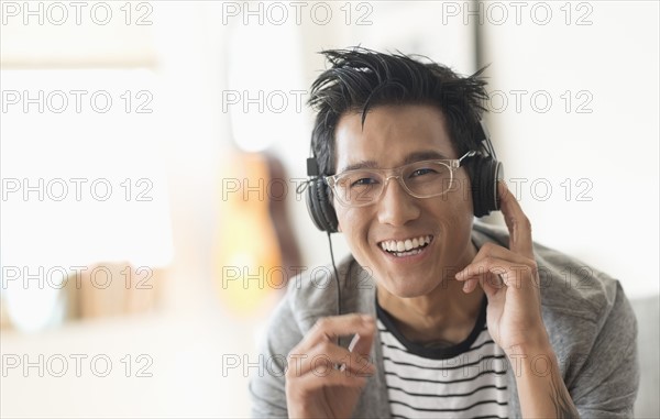 Cheerful man listening to music.