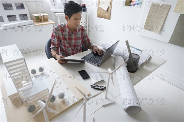 Architect working in office.