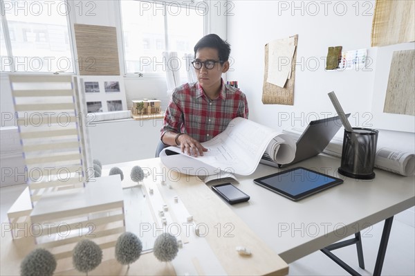 Architect working in office.