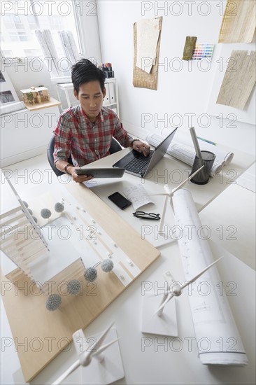 Architect working in office.