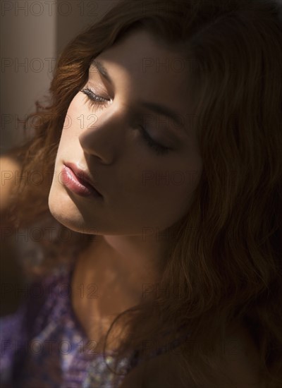 Portrait of beautiful woman with eyes closed.