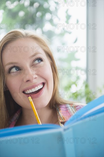 Portrait of young woman planning