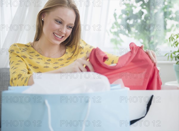 Blond woman looking at new clothing