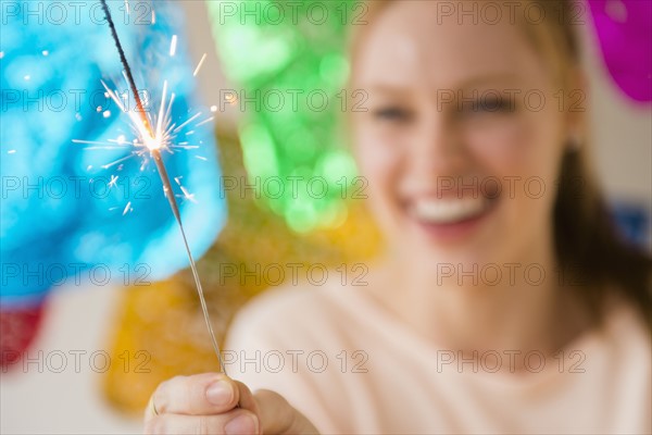 Woman holding sparkler