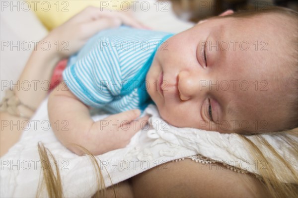 Mother holding newborn daughter