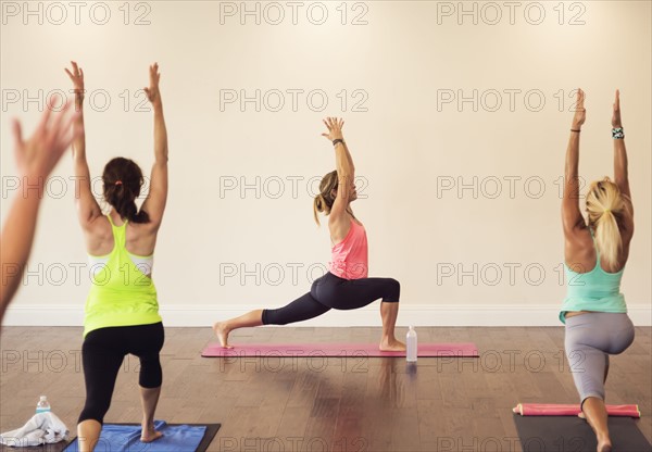 Women exercising yoga