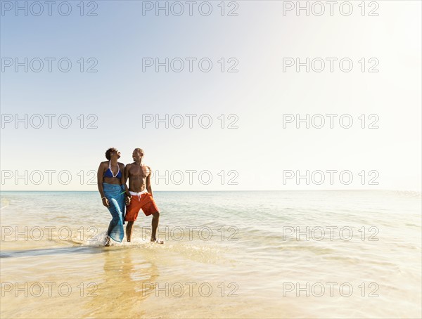 Mature couple walking in sea