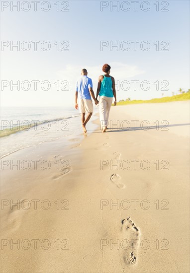 Mature couple walking on beach