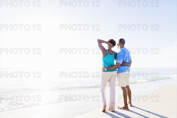 Mature couple standing on beach