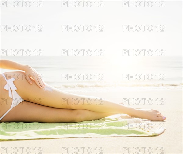 Woman applying sun protector