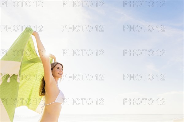 Woman holding green towel