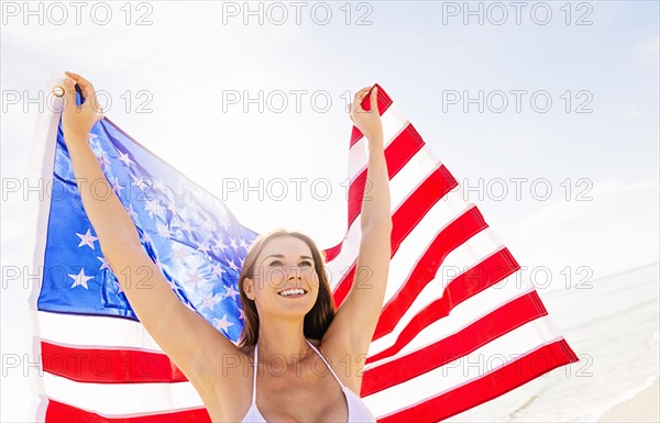 Woman holding American flag