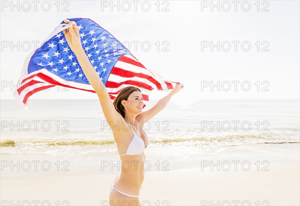 Woman holding American flag