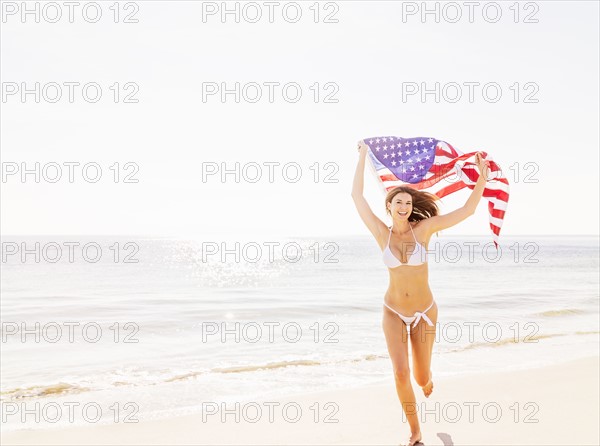 Woman holding American flag