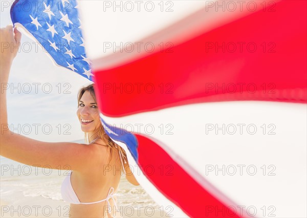 Woman holding American flag