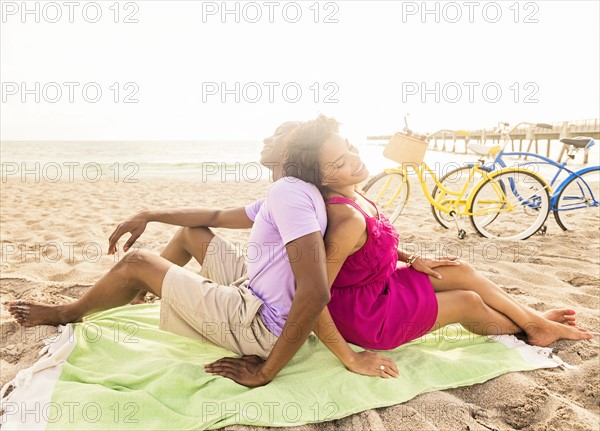 Young couple relaxing on beach