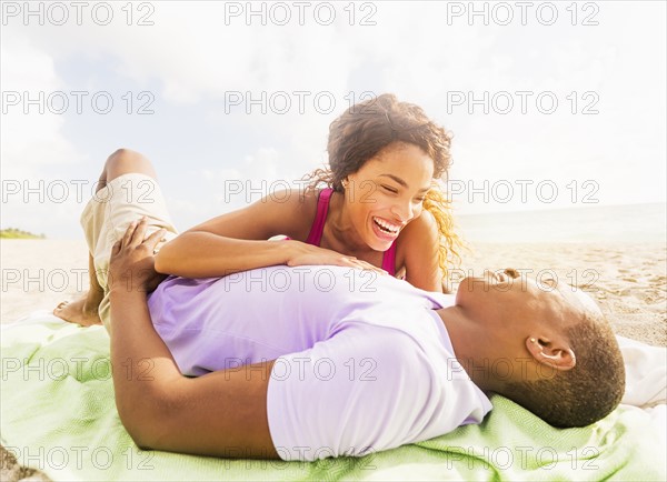 Young couple relaxing on beach