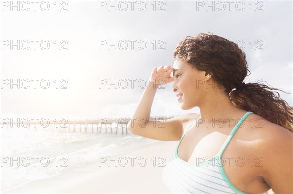 Portrait of woman looking at sea