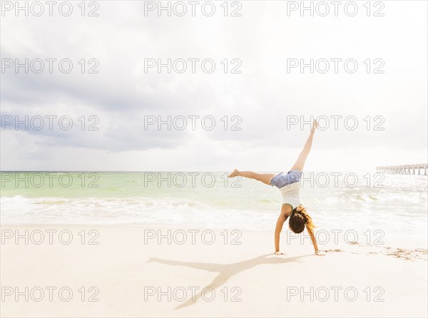 Woman exercising on beach