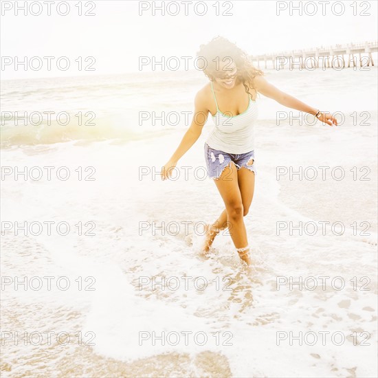 Portrait of woman standing on beach