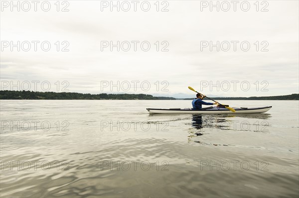 Man kayaking on lake