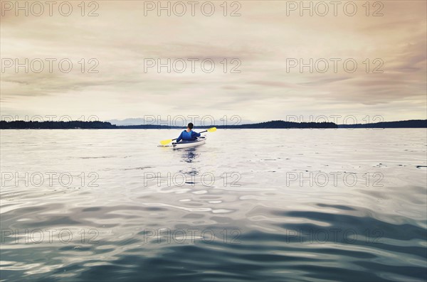 Man kayaking on lake