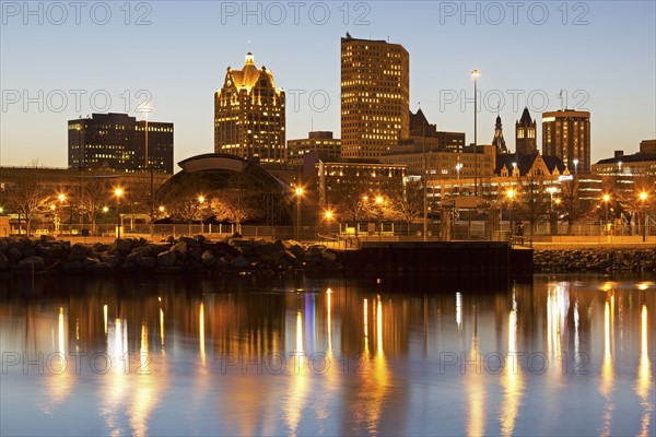 Street lights reflecting in lake