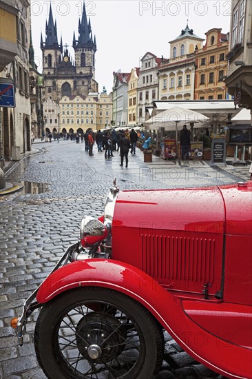 Old town with retro car in foreground