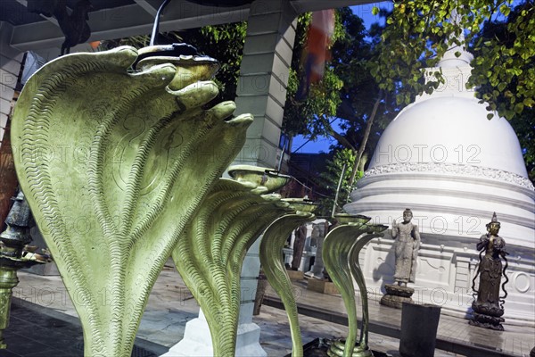 Cobra statues in front of stupa in Gangaramaya Temple area