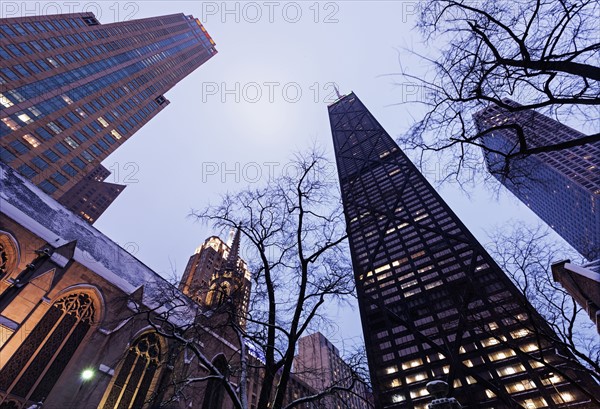Low angle view of John Hancock Center seen from Fourth Presbyterian Church