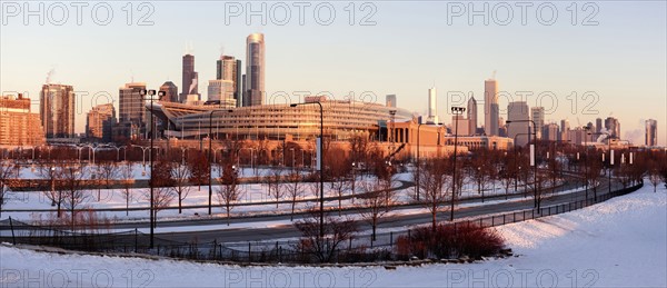 Soldier Field and city skyline at sunrise