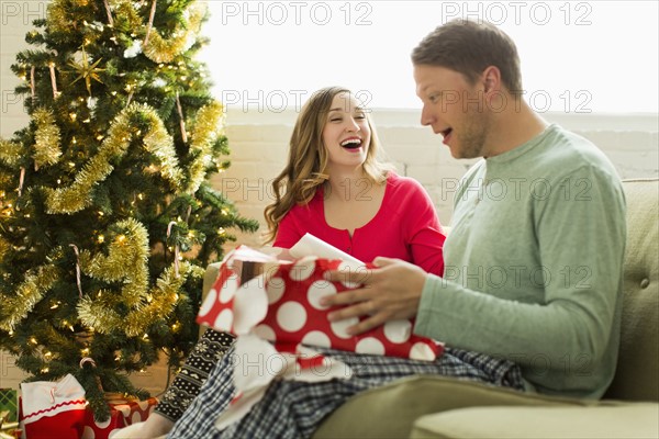 Young man surprised with Christmas gift