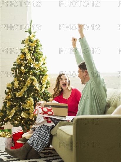 Young man surprised with Christmas gift