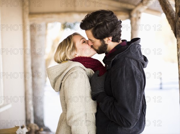 Young couple kissing outdoors