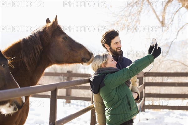 Young couple self photographing