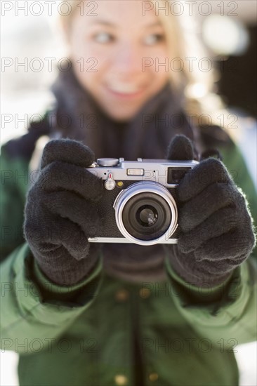 Woman holding old-fashioned camera