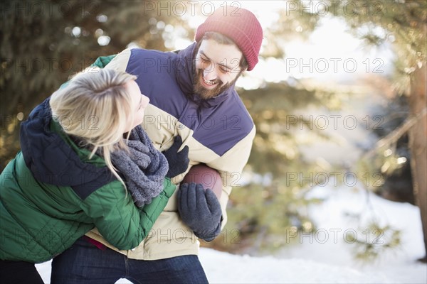 Couple playing American football