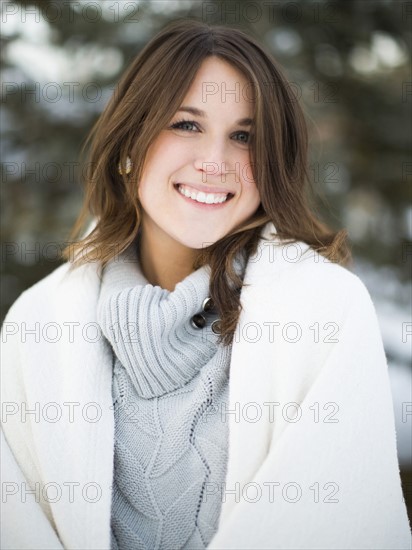 Portrait of woman smiling outdoors