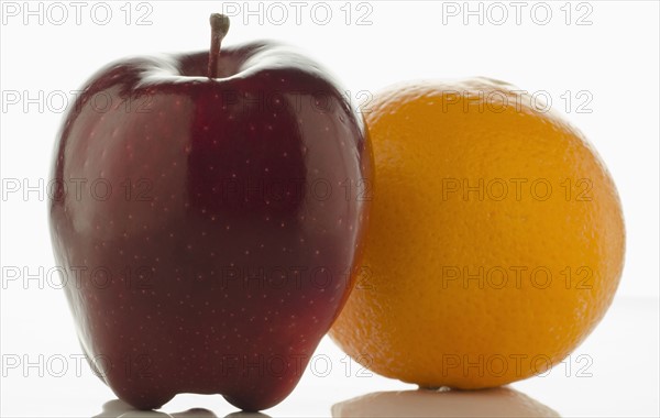 Studio shot of apple and orange