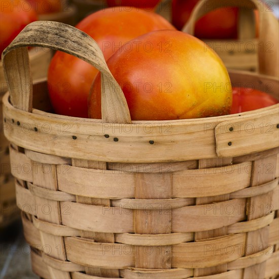 Heirloom tomatoes in carton.