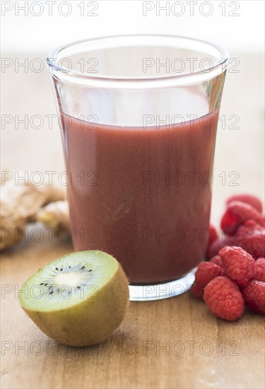 Studio shot of kiwi and raspberry juice.