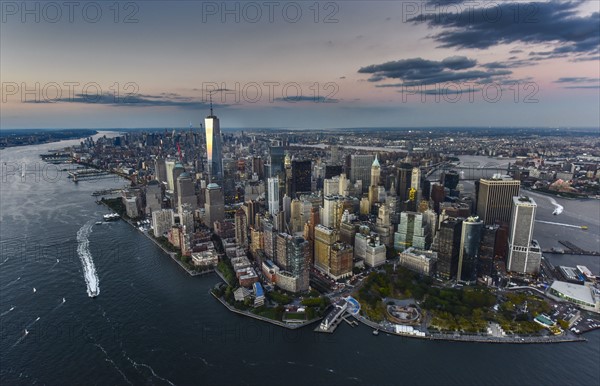 Aerial view of city with Freedom tower at sunset. New York City, New York.