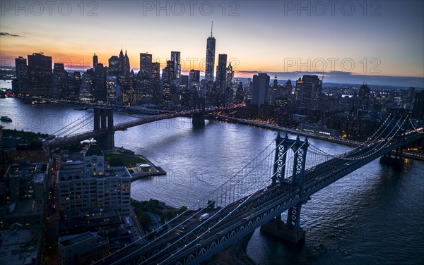 Aerial view of city with Freedom tower at sunset. New York City, New York.