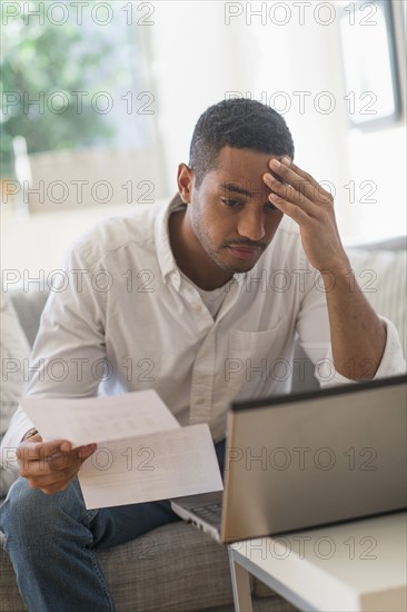 Man paying bills online.