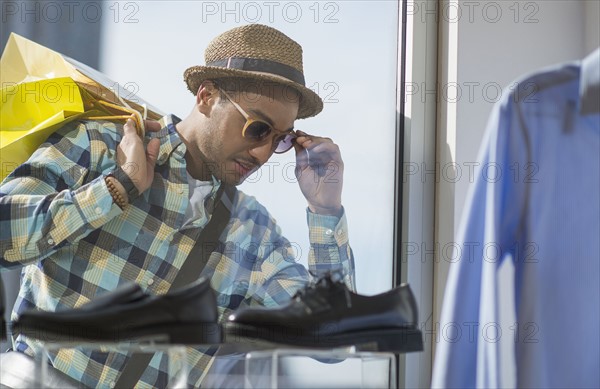 Stylish man window shopping.