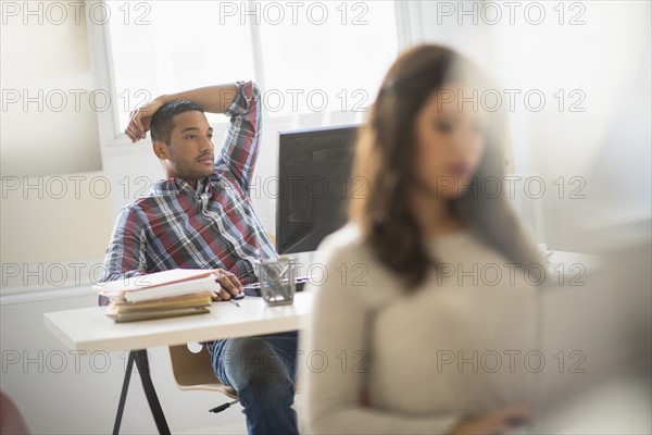 Businessman relaxing in office.